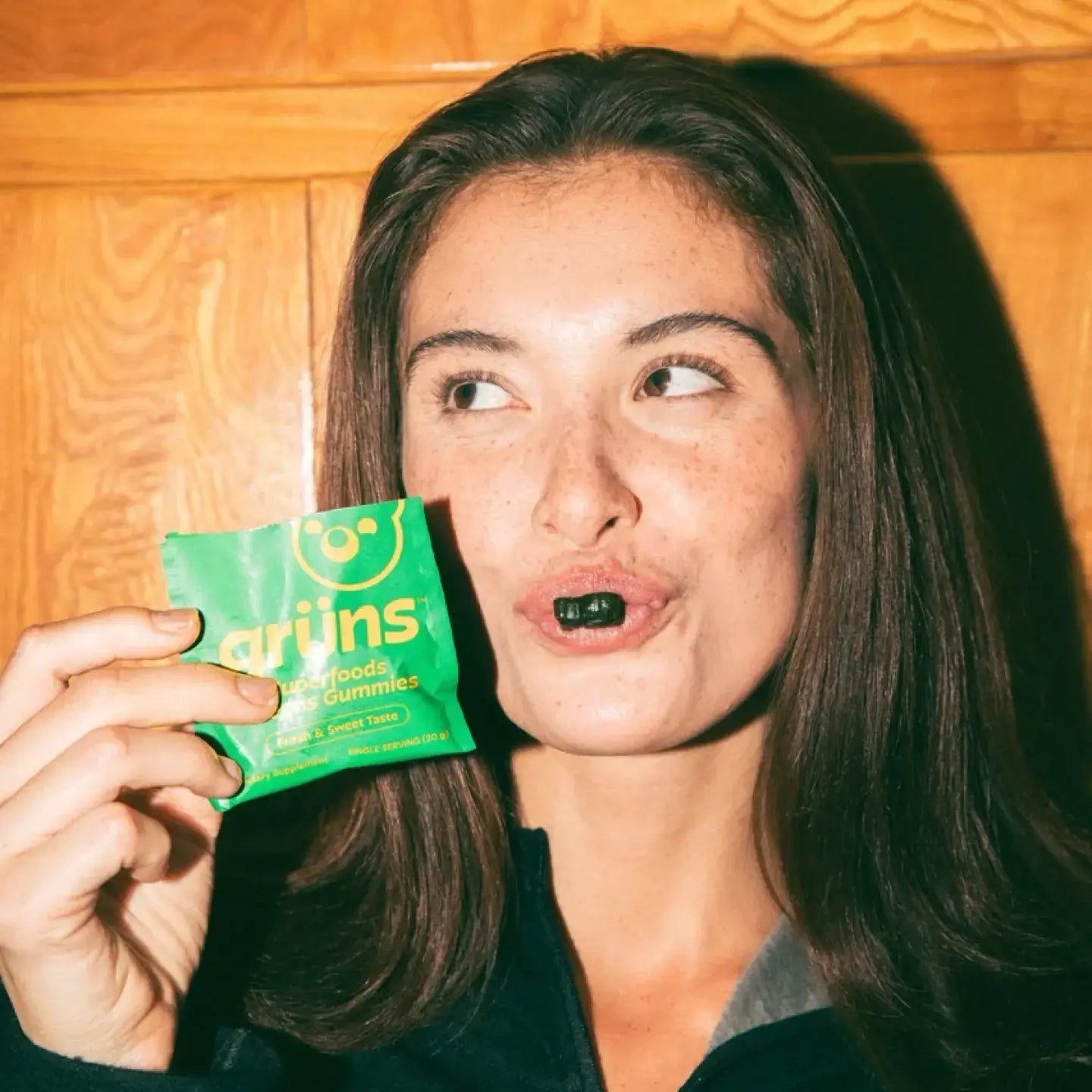 Woman tasting Gruns gummy